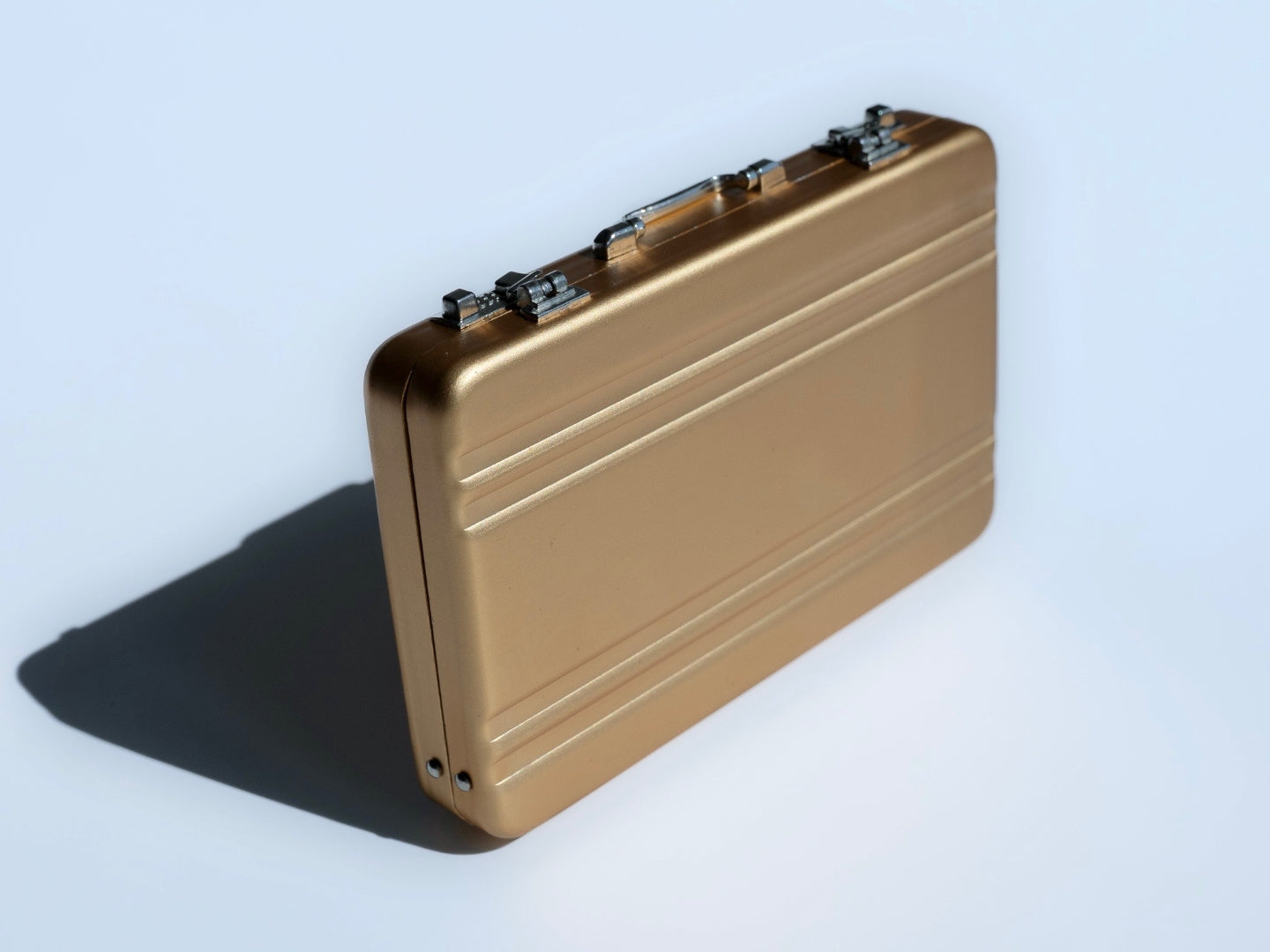 Gold briefcase angled view